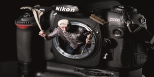 Hoe voorkom ik dat stof of vuil zich hecht op de beeldsensor?